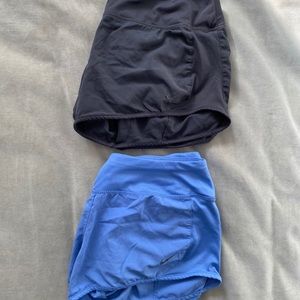 Two Nike dry-fit running shorts